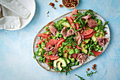 Grapefruit, broad bean and rocket salad with prosciutto