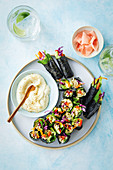 Rainbow sushi rolls with sesame mayonnaise