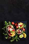 Taco shells with minced meat and vegetables