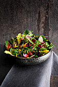 Wild herb and flower salad with croutons and honey mustard dressing