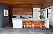 Modern open kitchen with wooden fronts and kitchen island