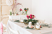 Flower arrangements on table set for Easter