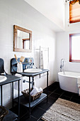 Black and white bathroom with an industrial style vanity