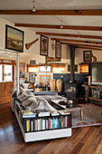 Sofa with integrated bookshelves in rustic living room