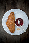 Croissant and Jam on a Plate