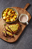 Beef steak with a handmade sour milk cheese crust and fried potatoes