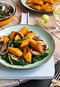 Sweet potato gnocchi with spinach and mushrooms