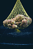 Jerusalem artichokes in a net