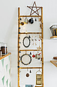 Festively decorated bamboo ladder in kitchen