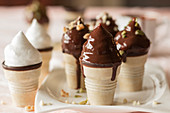 Chocolate marshmallow in ice cream cones with chocolate glaze