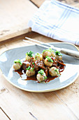 Lamb ragout and mini potato dumplings with roast onions