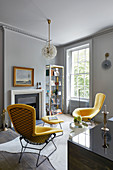 Two modern yellow armchairs in classic living room