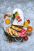 Christmas stollen on an openwork stand with citrus chips, decorated in a Christmas design