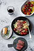 Rocket risotto with steak and roasted tomatoes