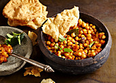 Indian chickpea curry with papadams
