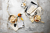 An astrology still life with star signs, star decorations, soft cheese and white chocolate