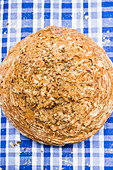 Beer bread with spices on a blue and white checkered tablecloth