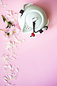 Tea set with cup and teapot as a tea time concept on pink background