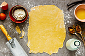 Baking ingredients and tools - kitchen utensils, flour, sugar, vanilla, milk and eggs