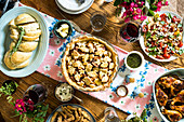 Abundant late summer spread with cardamom apple pie, paprika chicken, basil tomato salad, garlic challah and fried okra