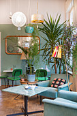 Retro-style cafe in shop decorated with houseplants and lamps