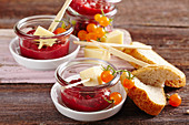 Homemade dirndl chutney (cherries) in glasses with red wine, ginger, and cheese skewers
