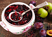 Homemade stewed elderbetrries (plum compote with elderberries, apple, orange juice, red wine, spices)