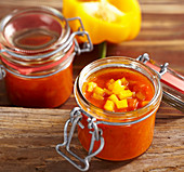 Homemade spicy pepper sauce in preserving jars