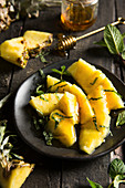 Pineapple slices and chunks in honey and fresh mint
