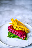 Thin pancakes with carrot and beet juice