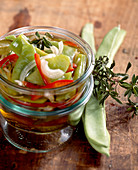 Pickled green runner beans with peppers, white wine vinegar and savory