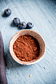 Cocoa powder and blueberries