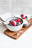 Muesli with berries and grated coconut