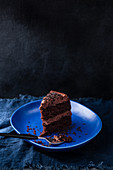 A single slice of chocolate cake