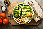 Vegan lunch bowl with rice, chickpeas and green vegetables