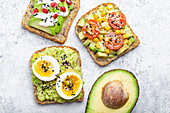 Clean eating - avocado toasts with egg, tomatoes and seasonings