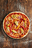 'Sicilia' pizza with peppers, ham and artichokes