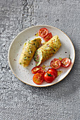 Omelette rolls with cheese, ham and herbs