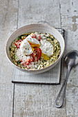 Hearty porridge with poached egg and parmesan cheese