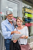 Couple reading an information booklet
