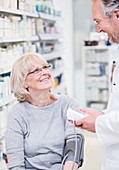 Pharmacist checking blood pressure