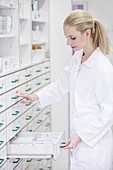 Pharmacist looking for medicine