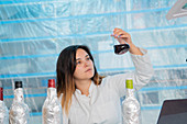 Testing wine in quality control lab