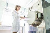 Technician working autoclave