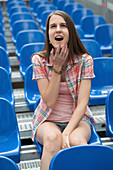Woman sitting in arena