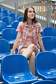 Woman sitting in arena