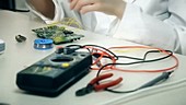 Female engineer in electronics lab