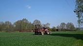 Tractor fertilising field