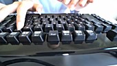 Person typing on computer