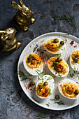 Deviled eggs with paprika, capers and dill